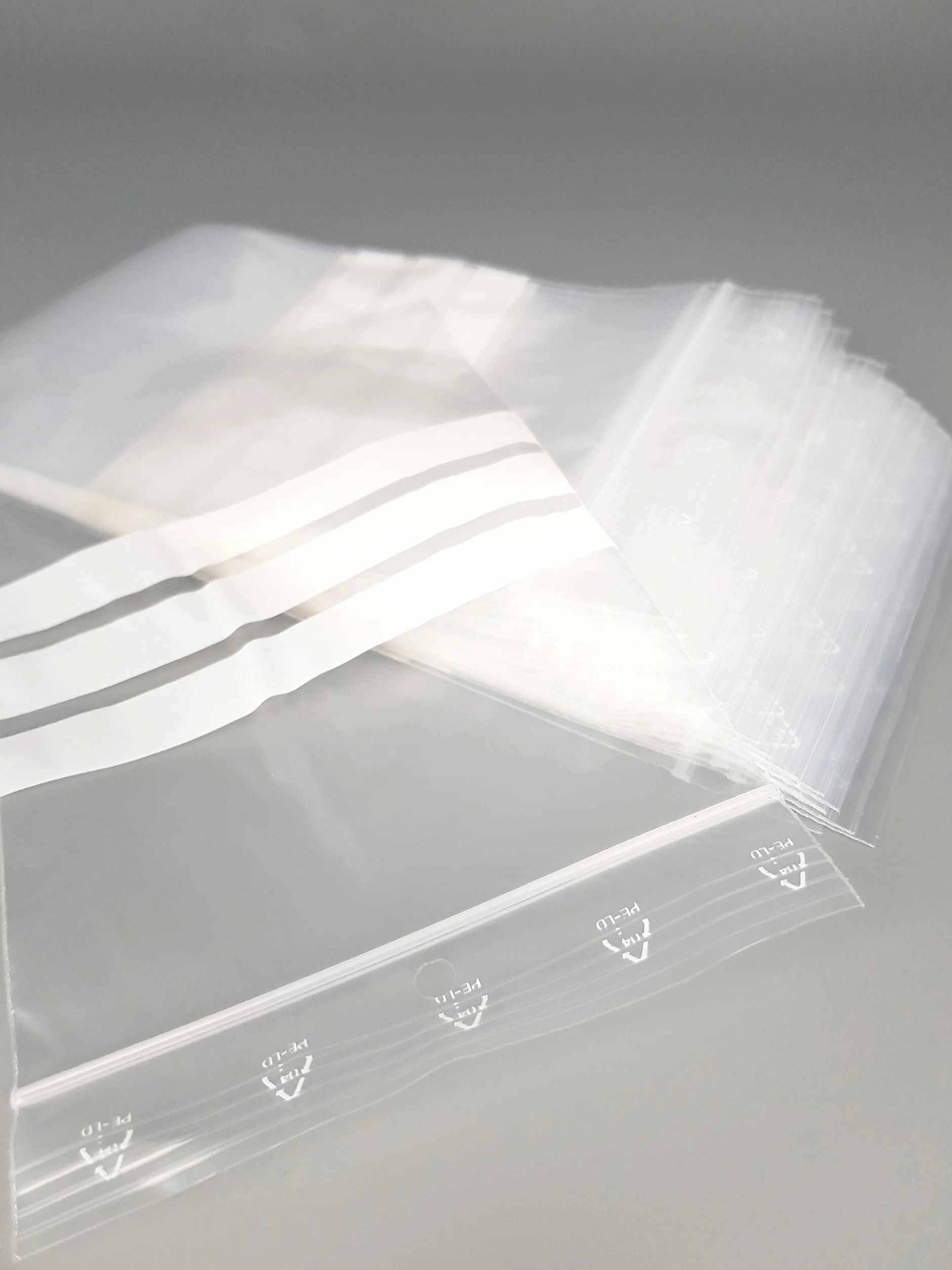 Bolsa con cierre zip y 3 tiras blancas, lote de 100, 50 micras (100 mm x 150 mm)